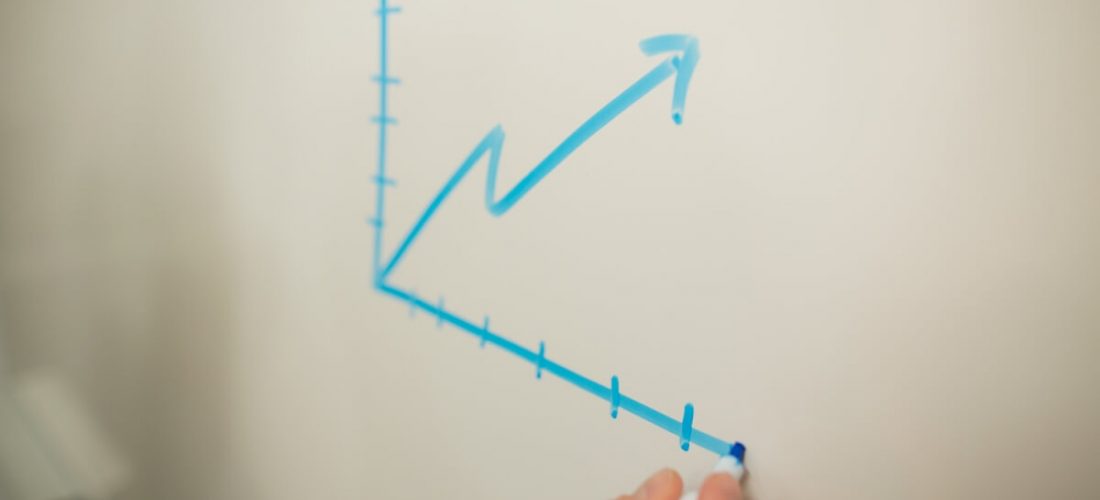 Whiteboard with chart showing career achievement